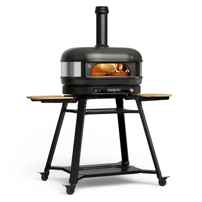 Portable pizza oven on a stand with visible flames inside, on a white background