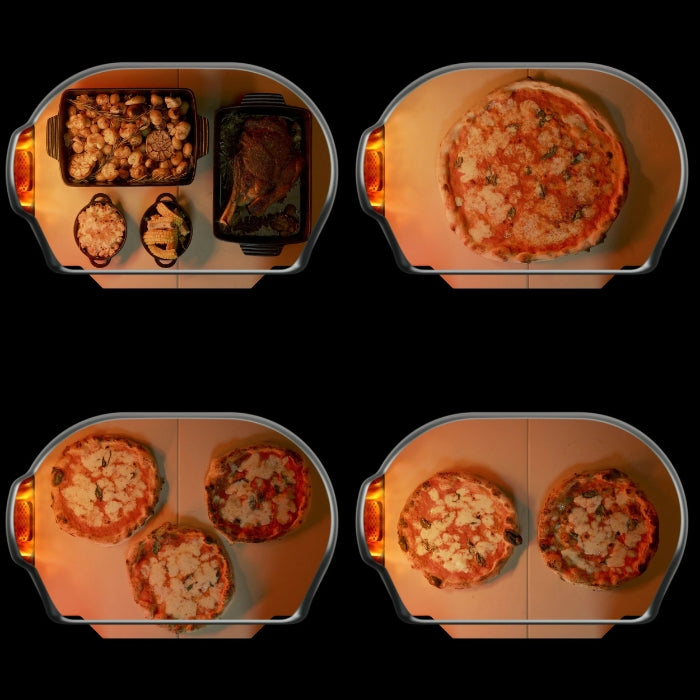 Top-down view of a pizza oven with pizzas and side dishes inside