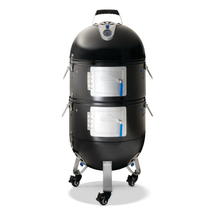 A black ceramic kamado-style smoker with two stacked cooking chambers, silver metal doors, and caster wheels, shown on a clean white background.