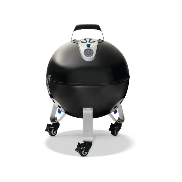 A black ceramic kettle-style grill with a silver lid trim, three silver legs, and black caster wheels, shown on a white background.