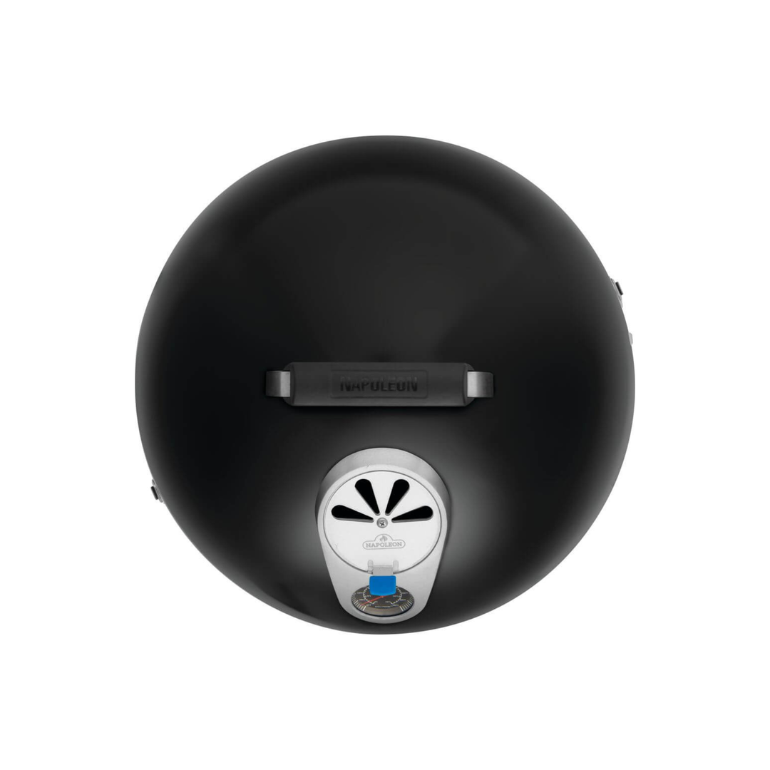 Top-down view of a black round grill lid with a silver vent and a small blue control knob, isolated on a white background.